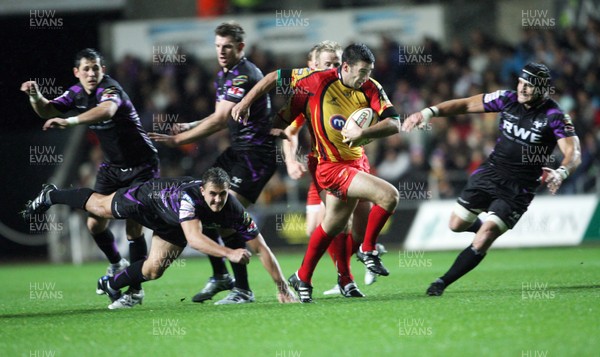 30.10.10 Ospreys v Dragons... Dragon's Tom Riley breaks through the Ospreys defences. 