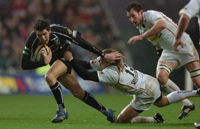 311206 - Ospreys v Newport Gwent Dragons - Magners League - Ospreys James Hook gets past Paul Emerick 