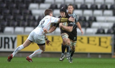 311206 - Ospreys v Newport Gwent Dragons - Magners League - Ospreys Ryan Jones takes on Ceri Sweeney 