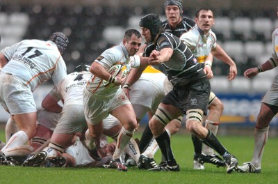 311206 - Ospreys v Newport Gwent Dragons - Magners League - Dragons Gareth Cooper gets past Ryan Jones 