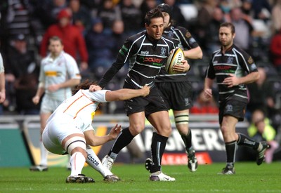 311206 - Ospreys v Newport Gwent Dragons - Magners League - Ospreys Gavin Henson is tackled by Colin Charvis 