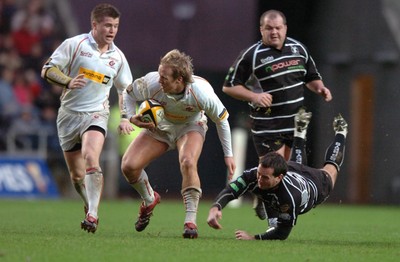 311206 - Ospreys v Newport Gwent Dragons - Magners League - Dragons Ashely Smith gets past Shaun Conner 