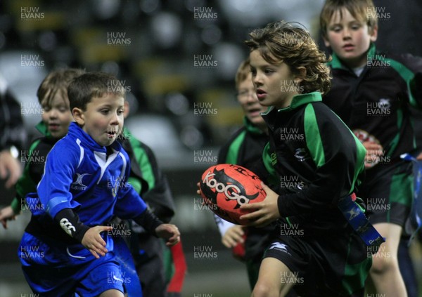 30.10.10 Ospreys v Newport Gwent Dragons - Magners League -  Under 8's action: Porthcawl(black/green) v Bryncoch. 