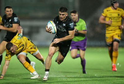 241026 - Ospreys v Dragons - United Rugby Championship - Reuben Morgan-Williams of Ospreys runs in to score a try
