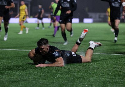 241026 - Ospreys v Dragons - United Rugby Championship - Reuben Morgan-Williams of Ospreys runs in to score a try