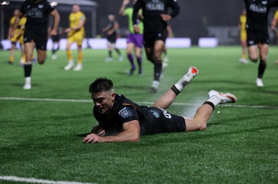 241026 - Ospreys v Dragons - United Rugby Championship - Reuben Morgan-Williams of Ospreys runs in to score a try