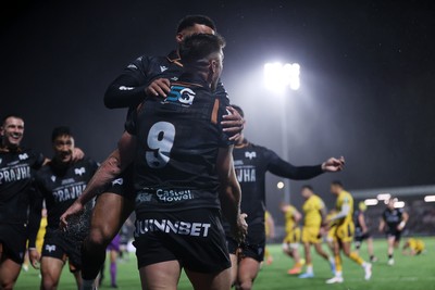 241026 - Ospreys v Dragons - United Rugby Championship - Reuben Morgan-Williams of Ospreys celebrates scoring a try with team mates