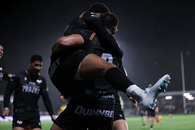 241026 - Ospreys v Dragons - United Rugby Championship - Reuben Morgan-Williams of Ospreys celebrates scoring a try with team mates