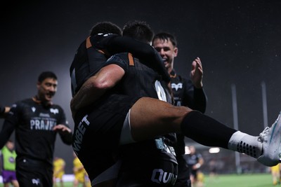 241026 - Ospreys v Dragons - United Rugby Championship - Reuben Morgan-Williams of Ospreys celebrates scoring a try with team mates
