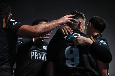 241026 - Ospreys v Dragons - United Rugby Championship - Reuben Morgan-Williams of Ospreys celebrates scoring a try with team mates
