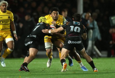 241026 - Ospreys v Dragons - United Rugby Championship - Fetuli Paea of Dragons is tackled by Harri Deaves of Ospreys 