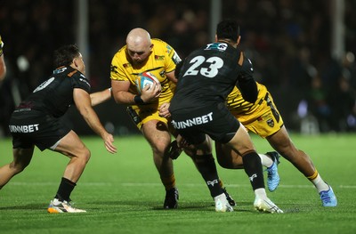 241026 - Ospreys v Dragons - United Rugby Championship - Dillon Lewis of Dragons is tackled by Dan Edwards of Ospreys 