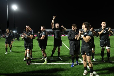 241026 - Ospreys v Dragons - United Rugby Championship - Ospreys celebrate with fans at full time
