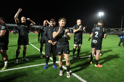 241026 - Ospreys v Dragons - United Rugby Championship - Ospreys celebrate with fans at full time
