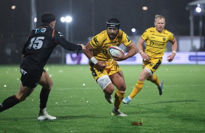 241026 Ospreys v Dragons RFC, BKT United Rugby Championship - Anzelo Tuitavuki of Dragons RFC is tackled by Tom Rogers of Ospreys just short of the line