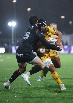 241026 Ospreys v Dragons RFC, BKT United Rugby Championship - Anzelo Tuitavuki of Dragons RFC is tackled by Tom Rogers of Ospreys just short of the line