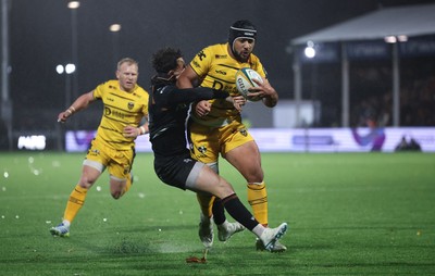 241026 Ospreys v Dragons RFC, BKT United Rugby Championship - Anzelo Tuitavuki of Dragons RFC is tackled by Tom Rogers of Ospreys just short of the line