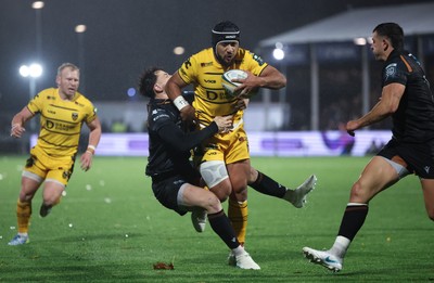 241026 Ospreys v Dragons RFC, BKT United Rugby Championship - Anzelo Tuitavuki of Dragons RFC is tackled by Tom Rogers of Ospreys just short of the line