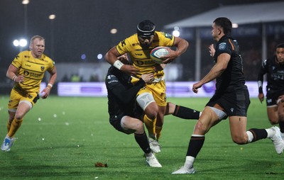 241026 Ospreys v Dragons RFC, BKT United Rugby Championship - Anzelo Tuitavuki of Dragons RFC is tackled by Tom Rogers of Ospreys just short of the line