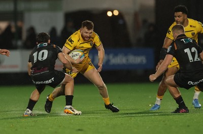 241026 Ospreys v Dragons RFC, BKT United Rugby Championship - Aneurin Owen of Dragons RFC takes on Dan Edwards of Ospreys and Keiran Williams of Ospreys