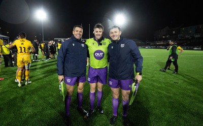 241026 Ospreys v Dragons RFC, BKT United Rugby Championship - Referee Ben Whitehouse with assistants Craig Evans, left, and Ben Breakspear at the end of the match