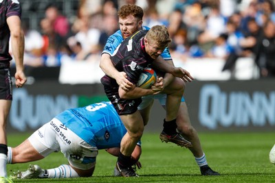 260425 - Ospreys v Dragons RFC - United Rugby Championship - Keiran Williams of Ospreys is tackled by Aneurin Owen of Dragons
