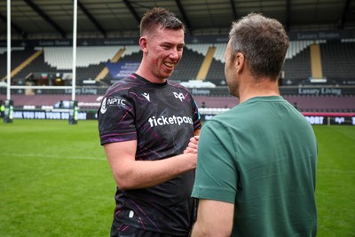 260425 - Ospreys v Dragons RFC - United Rugby Championship - Adam Beard of Ospreys at end of game with Ospreys Head Coach Mark Jones