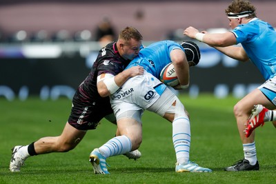 260425 - Ospreys v Dragons RFC - United Rugby Championship - Rhodri Jones of Dragons is tackled by Dewi Lake of Ospreys