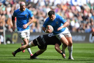 260425 - Ospreys v Dragons RFC - United Rugby Championship - Chris Coleman of Dragons is challenged by Adam Beard of Ospreys