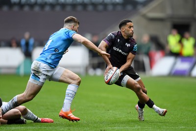 260425 - Ospreys v Dragons RFC - United Rugby Championship - Keelan Giles of Ospreys is challenged by Harry Rees-Weldon of Dragons
