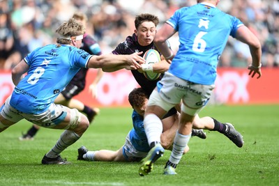 260425 - Ospreys v Dragons RFC - United Rugby Championship - Dan Edwards of Ospreys is challenged by Aneurin Owen of Dragons