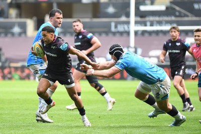 260425 - Ospreys v Dragons RFC - United Rugby Championship - Keelan Giles of Ospreys is challenged by Rhodri Jones of Dragons