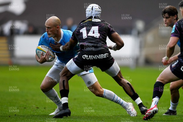 260425 - Ospreys v Dragons RFC - United Rugby Championship - Jared Rosser of Dragons is challenged by Dan Kasende of Ospreys