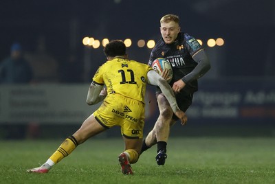 310126 - Ospreys v Dragons - United Rugby Championship - Iestyn Hopkins of Ospreys is tackled by Rio Dyer of Dragons 