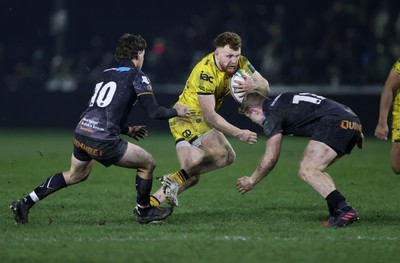 310126 - Ospreys v Dragons - United Rugby Championship - Aneurin Owen of Dragons is tackled by Keiran Williams of Ospreys 
