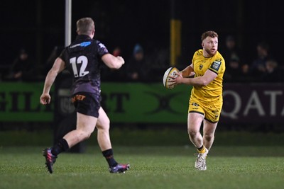 310126 - Ospreys v Dragons RFC - United Rugby Championship - Aneurin Owen of Dragons is challenged by Keiran Williams of Ospreys