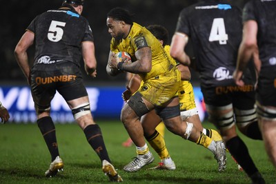 310126 - Ospreys v Dragons RFC - United Rugby Championship - Levi Douglas of Dragons is challenged by Ryan Smith of Ospreys