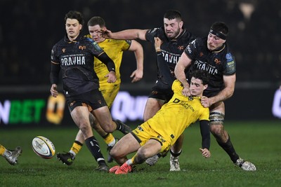 310126 - Ospreys v Dragons RFC - United Rugby Championship - Ryan Smith of Ospreys pulls down Che Hope of Dragons