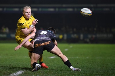 310126 - Ospreys v Dragons RFC - United Rugby Championship - Tinus De Beer of Dragons is challenged by Rueben Morgan-Williams of Ospreys
