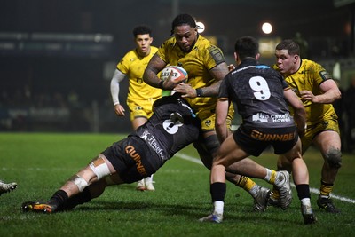 310126 - Ospreys v Dragons RFC - United Rugby Championship - Levi Douglas of Dragons is challenged by Morgan Morse of Ospreys