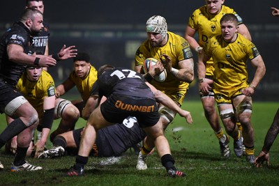 310126 - Ospreys v Dragons RFC - United Rugby Championship - Harri Keddie of Dragons is challenged by Keiran Williams of Ospreys
