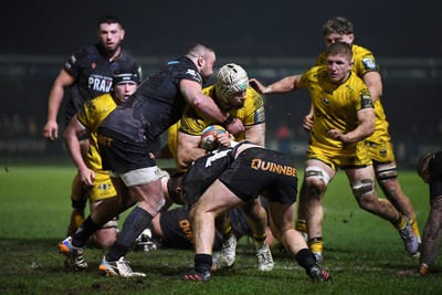310126 - Ospreys v Dragons RFC - United Rugby Championship - Harri Keddie of Dragons is challenged by Keiran Williams of Ospreys