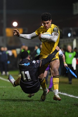 310126 - Ospreys v Dragons RFC - United Rugby Championship - Rio Dyer of Dragons is challenged by Keelan Giles of Ospreys