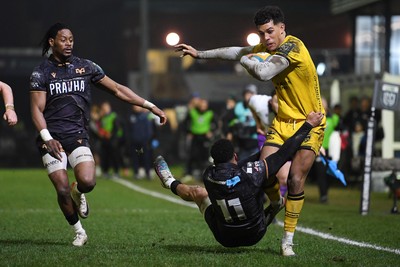 310126 - Ospreys v Dragons RFC - United Rugby Championship - Rio Dyer of Dragons is challenged by] Keelan Giles of Ospreys