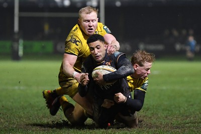 310126 - Ospreys v Dragons RFC - United Rugby Championship - Keelan Giles of Ospreys is challenged by Tinus De Beer of Dragons