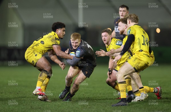310126 - Ospreys v Dragons - United Rugby Championship - Iestyn Hopkins of Ospreys is tackled by Fine Inisi of Dragons 