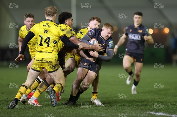 310126 - Ospreys v Dragons - United Rugby Championship - Iestyn Hopkins of Ospreys is tackled by Fine Inisi of Dragons 