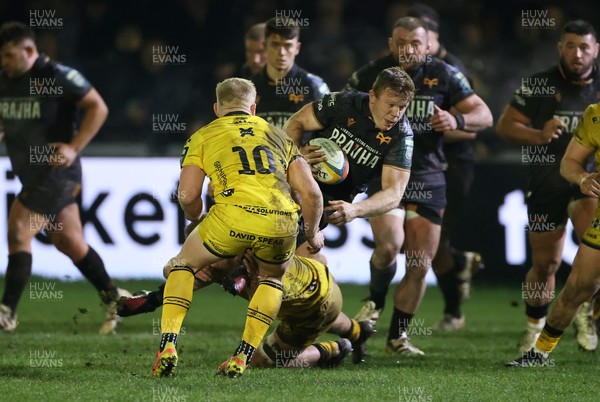 310126 - Ospreys v Dragons - United Rugby Championship - Keiran Williams of Ospreys is tackled by Rio Dyer of Dragons 