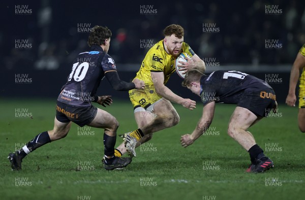 310126 - Ospreys v Dragons - United Rugby Championship - Aneurin Owen of Dragons is tackled by Keiran Williams of Ospreys 