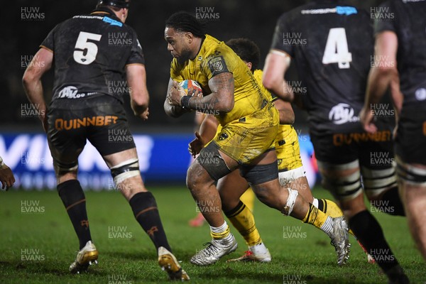 310126 - Ospreys v Dragons RFC - United Rugby Championship - Levi Douglas of Dragons is challenged by Ryan Smith of Ospreys